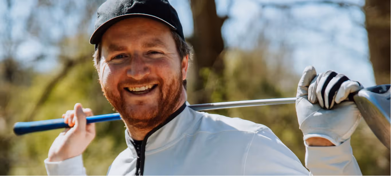 a man holding a golf club