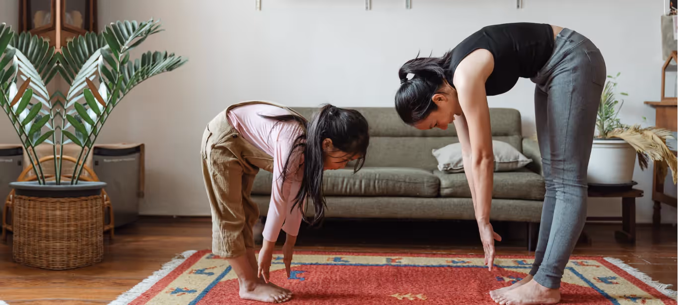 two women stretching at home