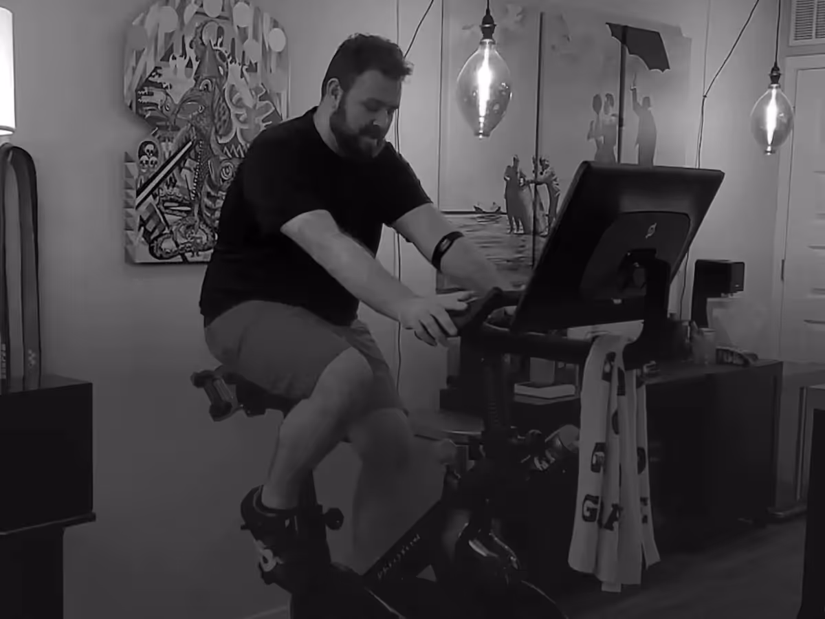 Logan on an exercise bike