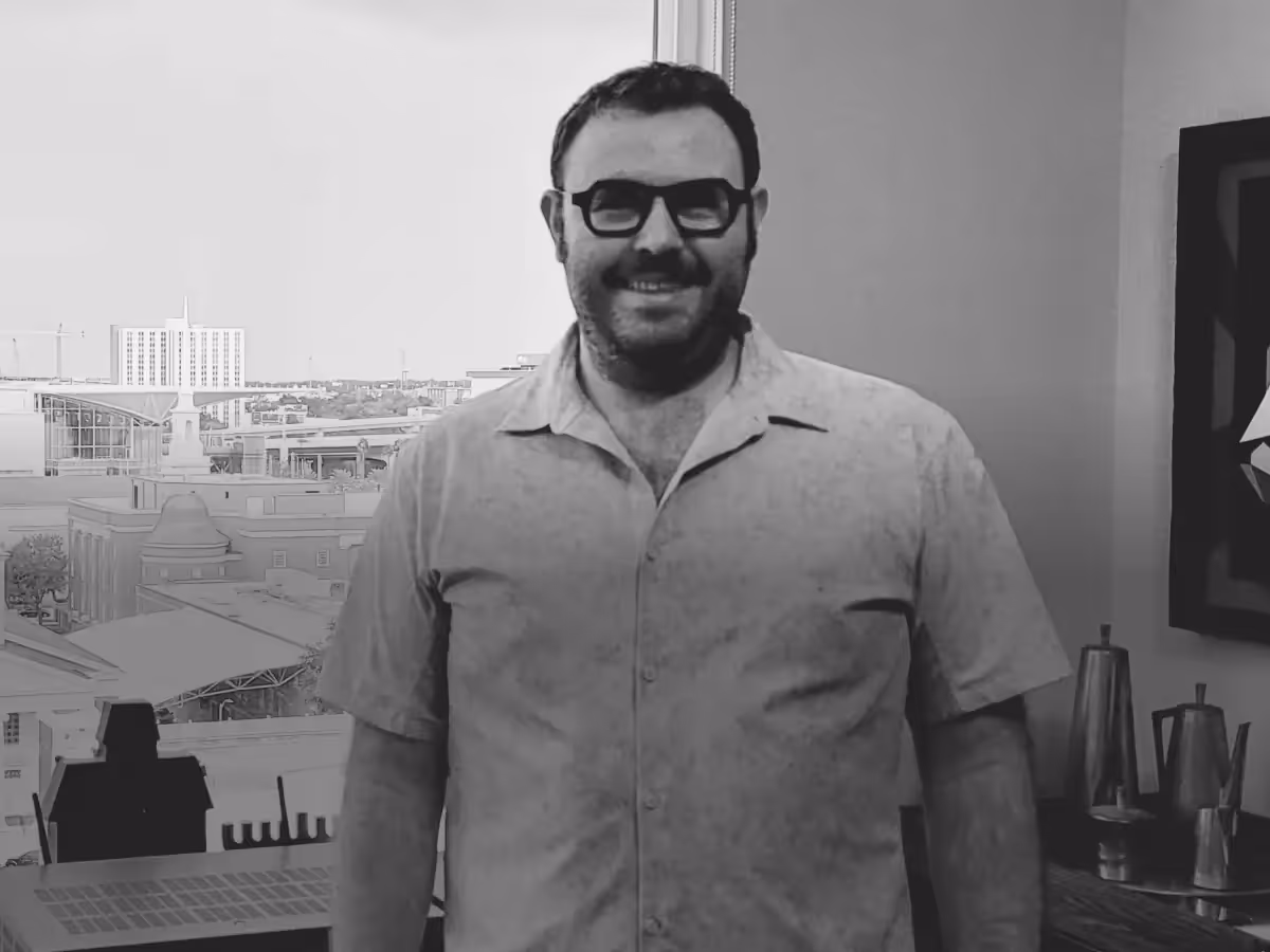 Logan wearing a CGM during his weight loss journey