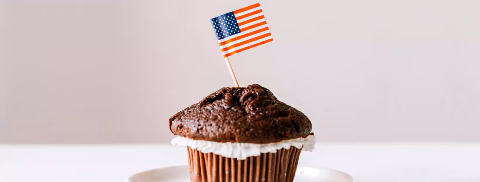 an American flag in a chocolate muffin