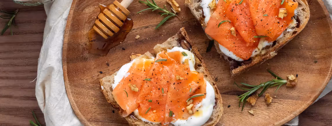 two toasts with salmon