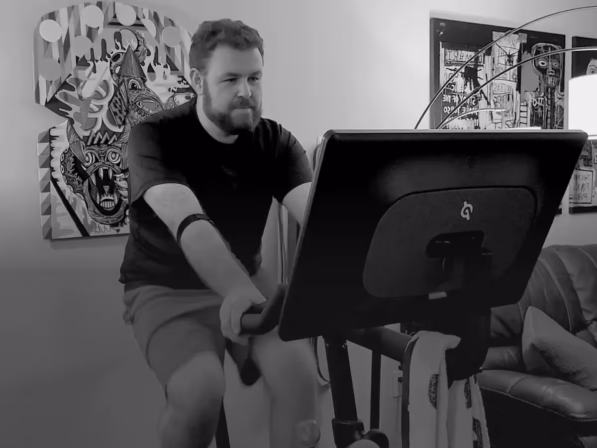 Logan exercising on his Peloton