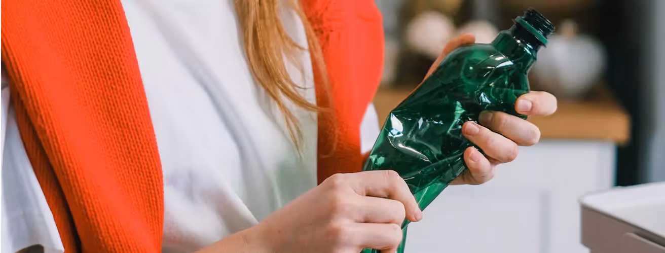 Person organizing glass containers