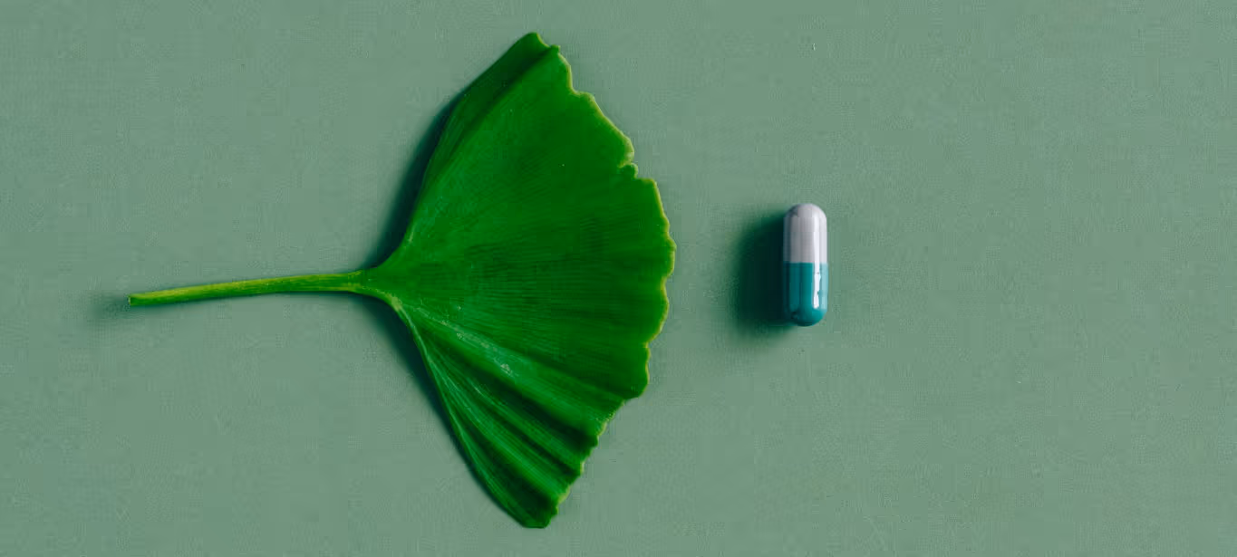 a leaf and a tablet of vitamin b12