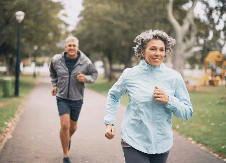 Two people jogging in the park