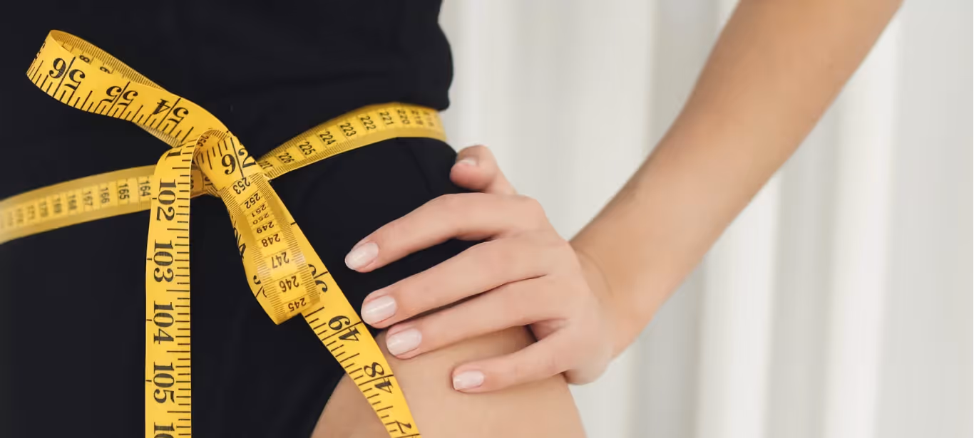 someone measuring their waist