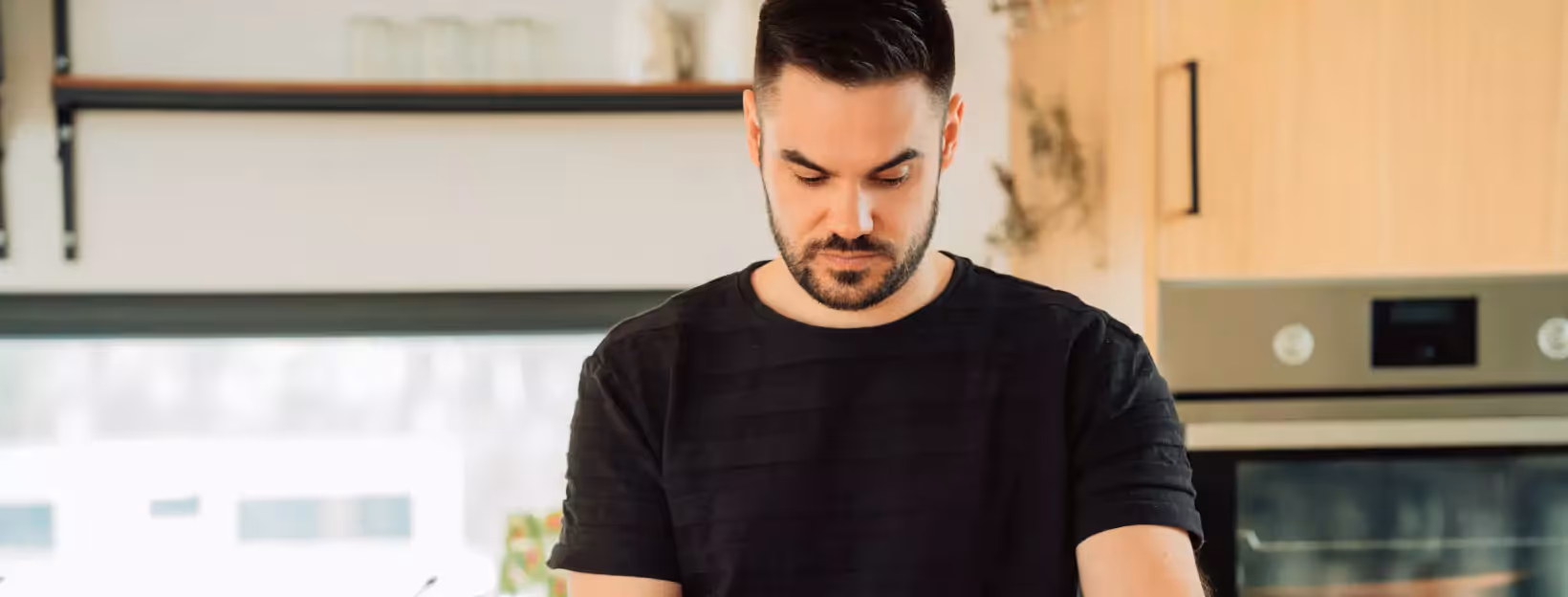 a man standing in the kitchen