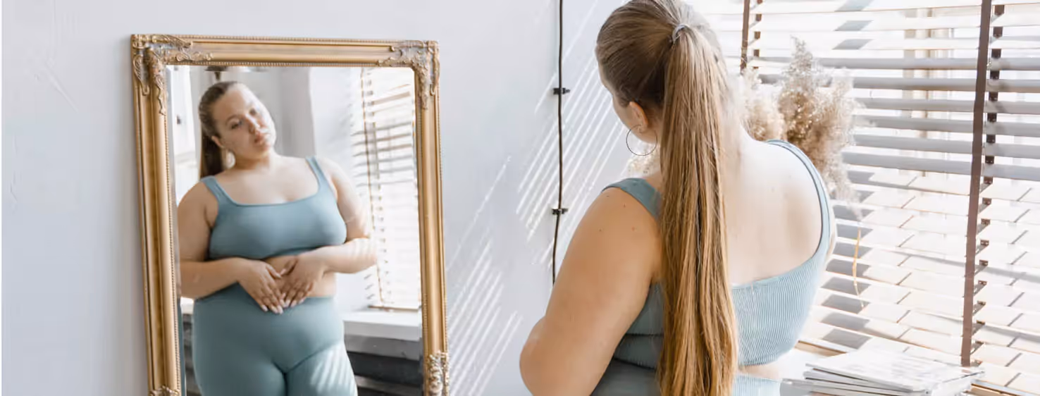 a person looking at themselves in the mirror