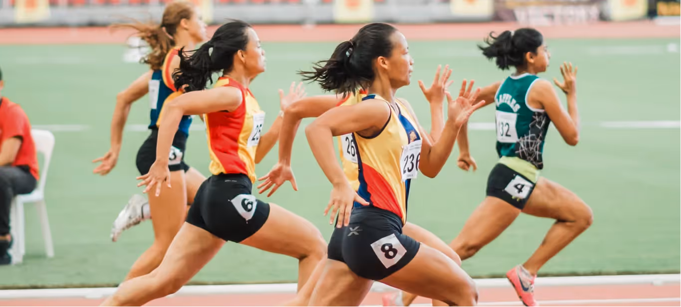 athletes sprinting during a track race