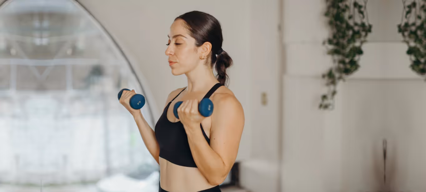a woman doing bicep curls