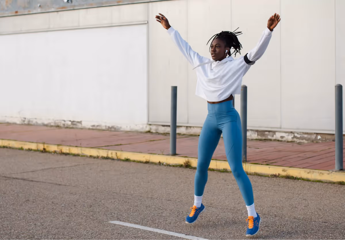 a girl doing jumping jacks