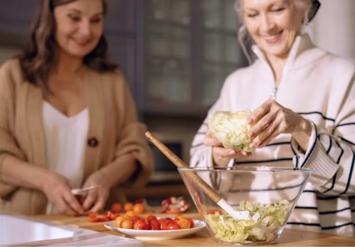 two women making a salad