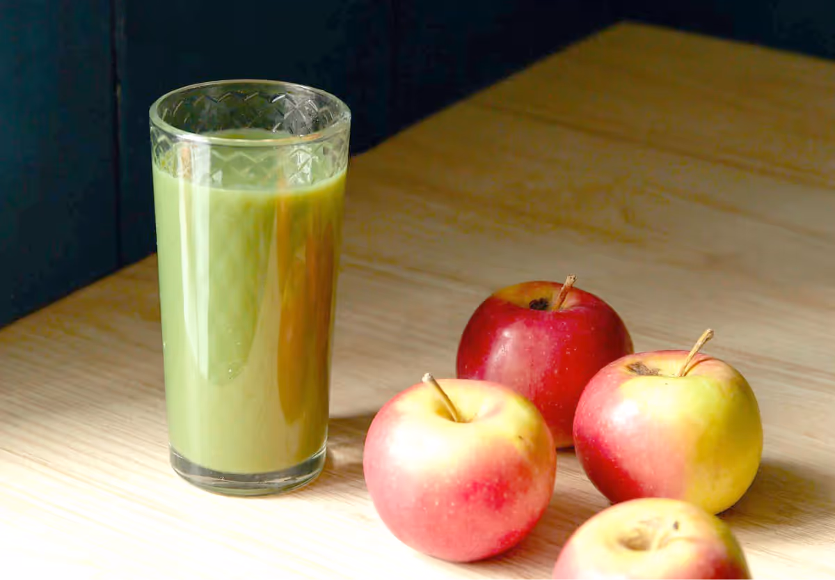 a green drink and apples