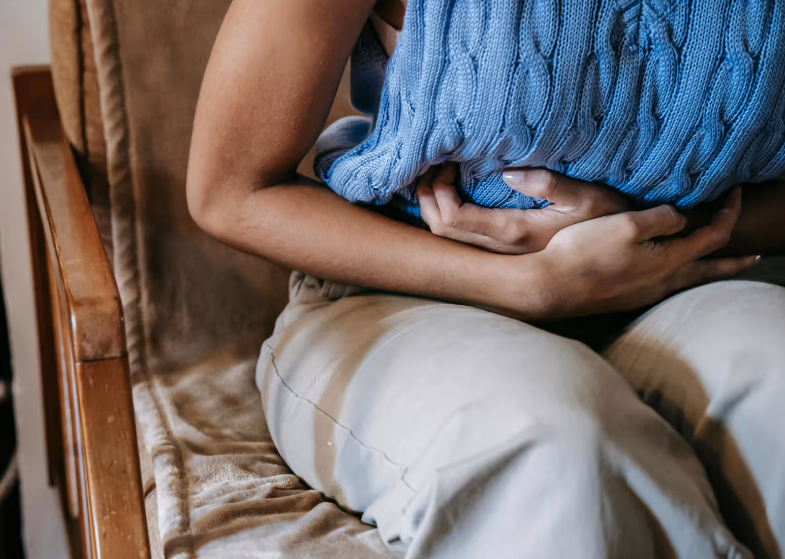 a woman holding her stomach