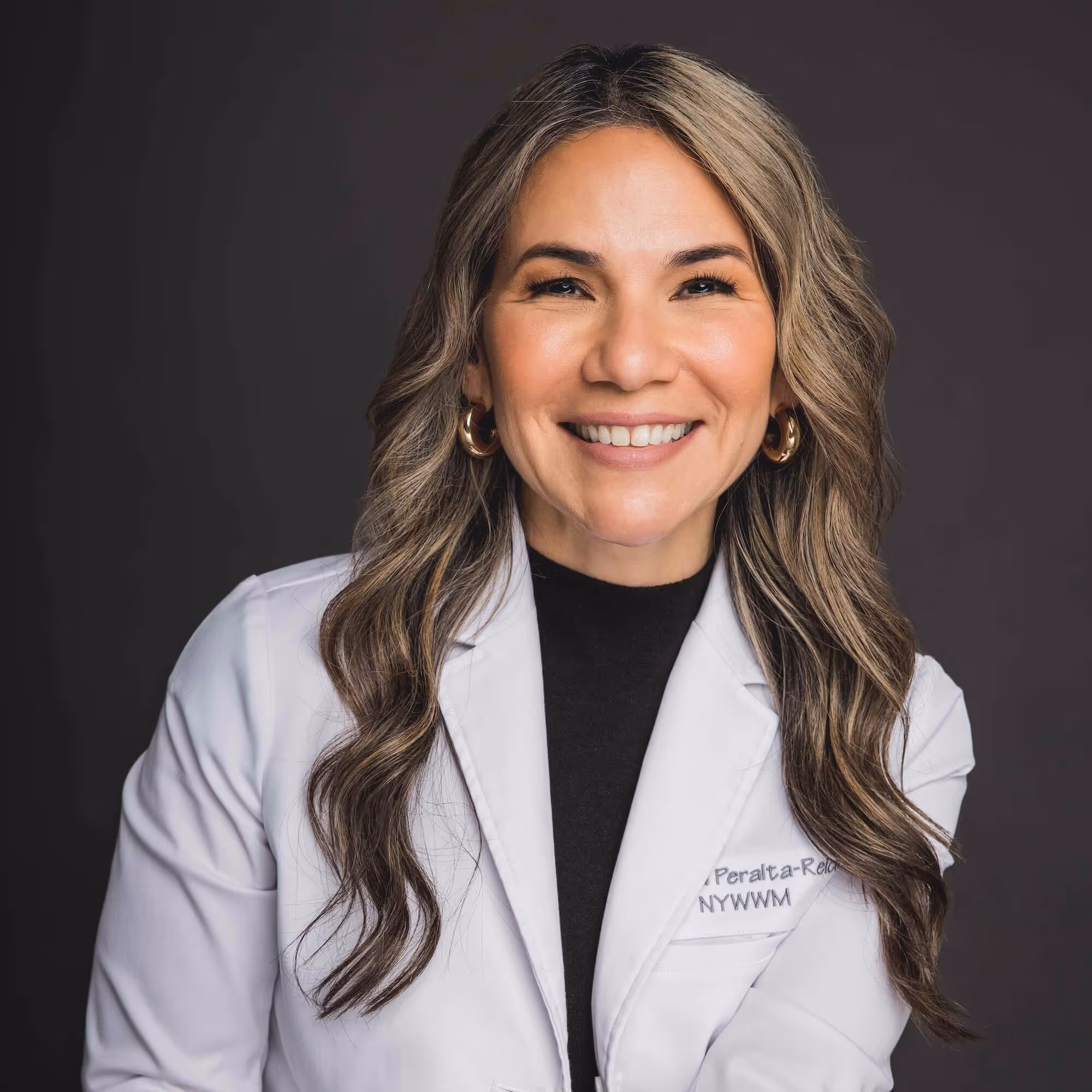 Dr. Dina Peralta-Reich, MD, FOMA, FAAP