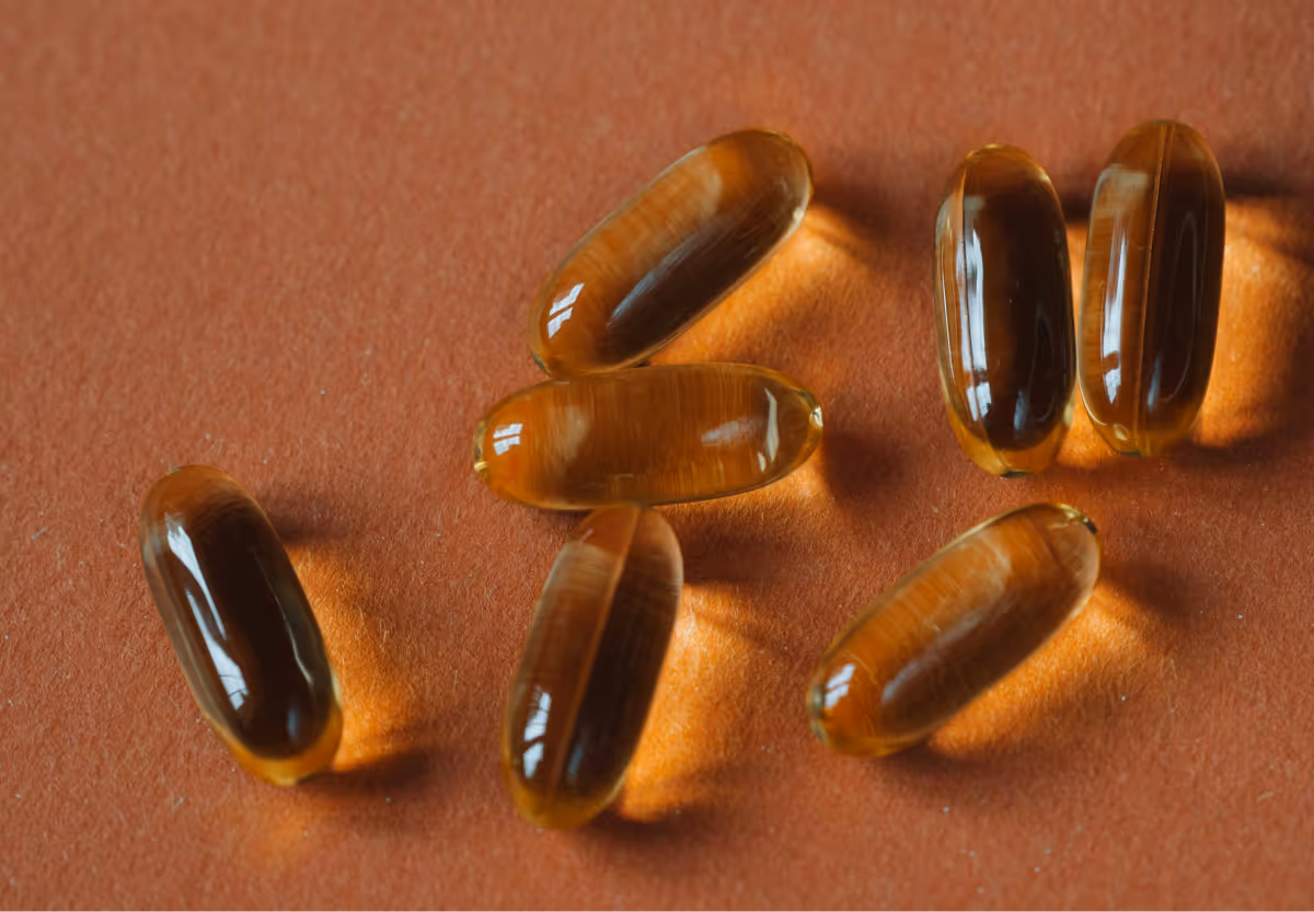 A brown backdrop with vitamin d capsules on it