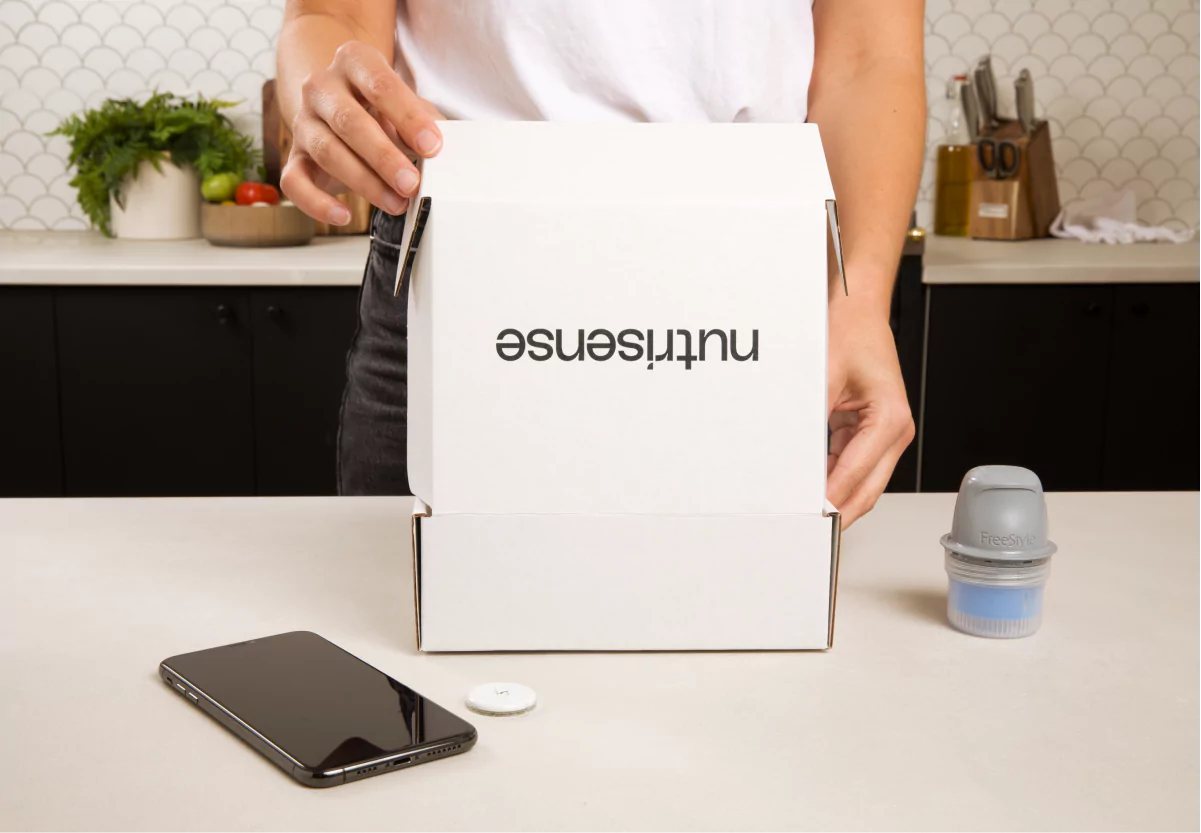 someone opening a box from nutrisense
