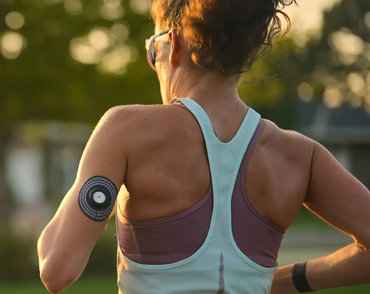 a woman running with the supersapiens cgm