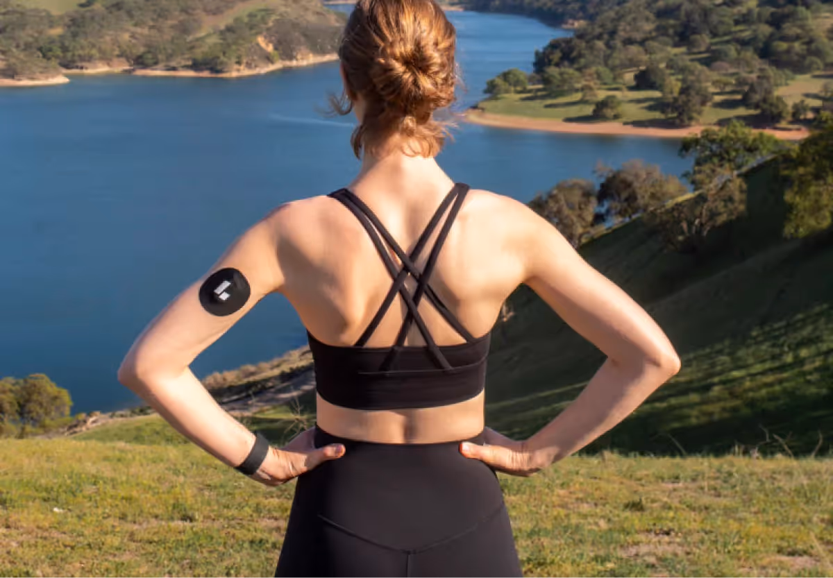 a woman wearing the Levels CGM