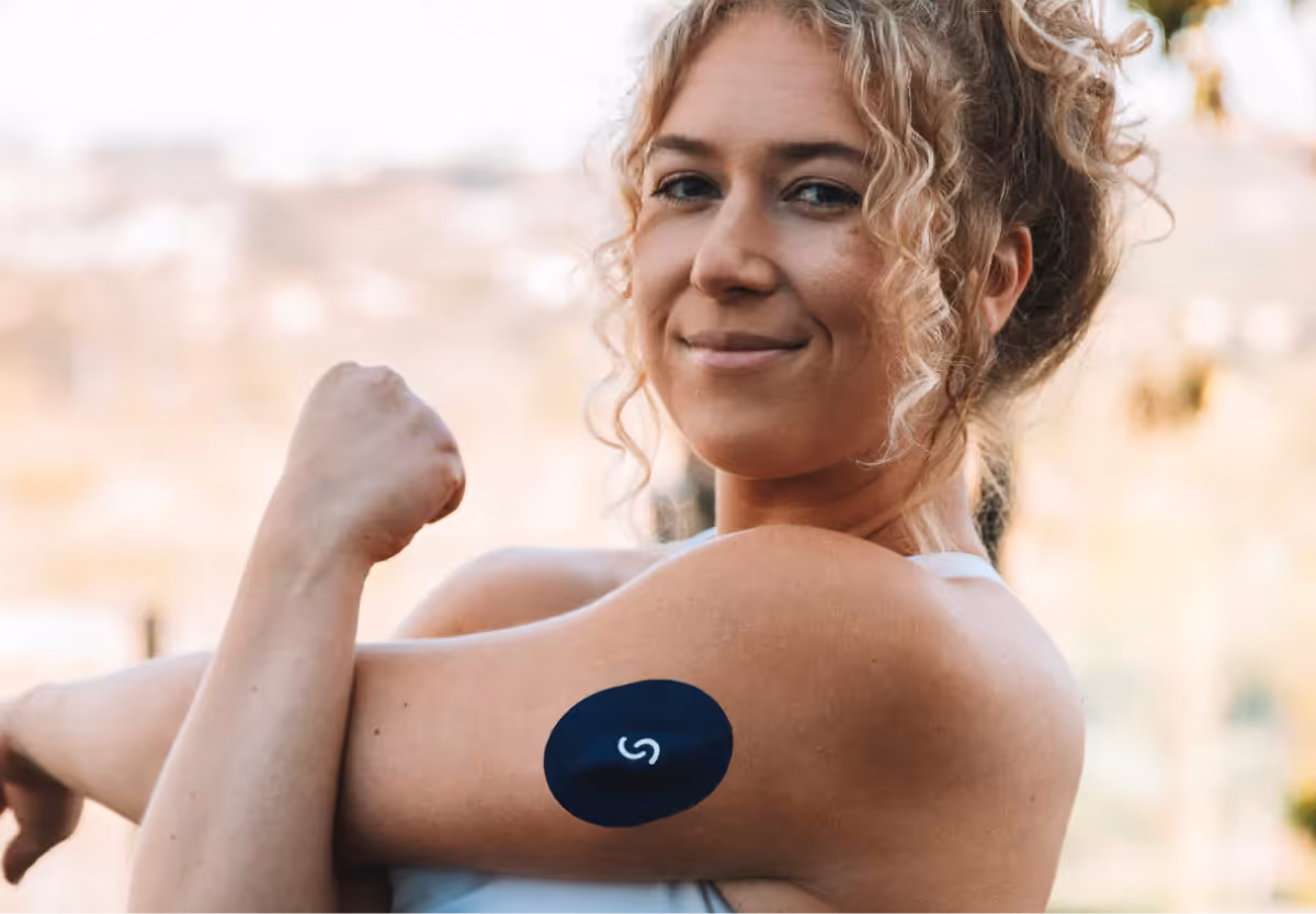 a woman with a Signos CGM