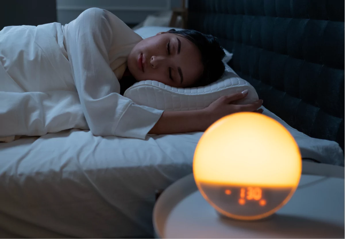 a woman laying in bed at night