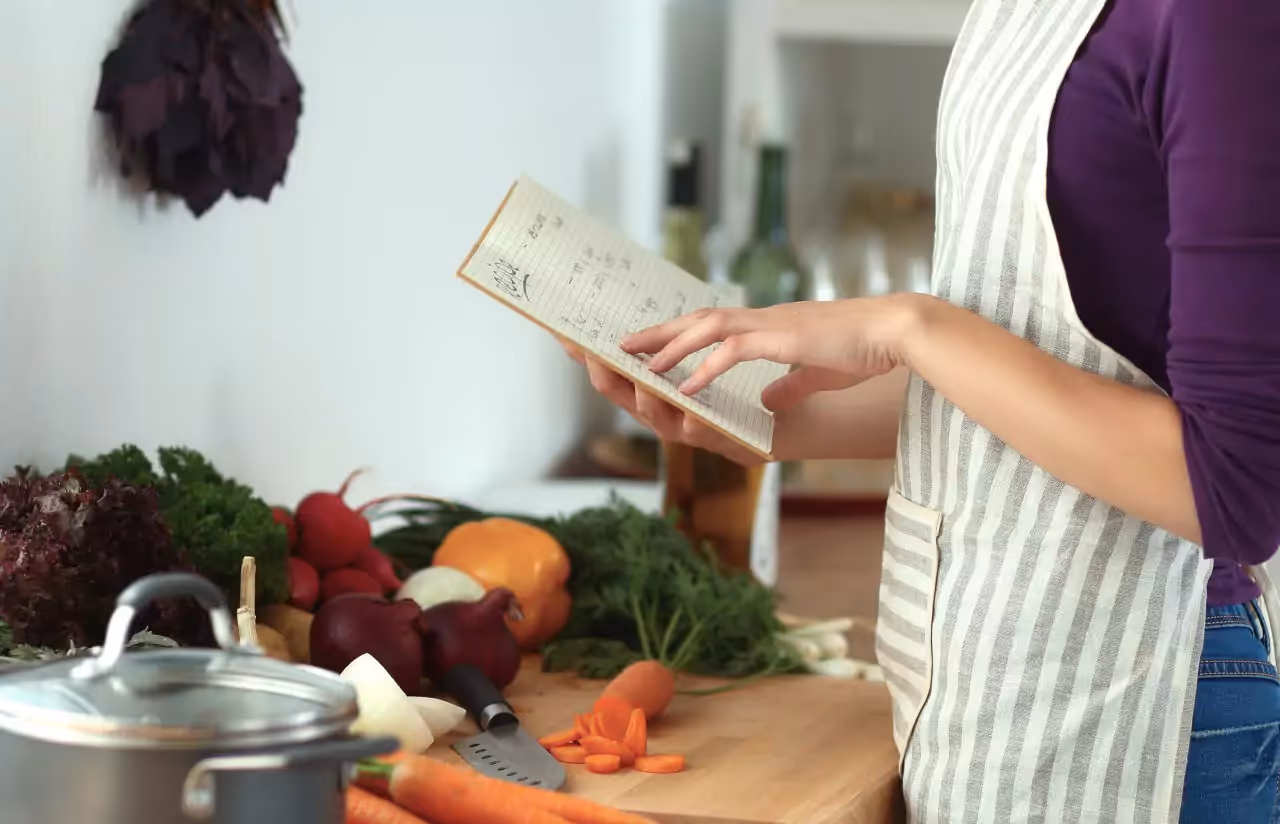 A person holding a notebook open