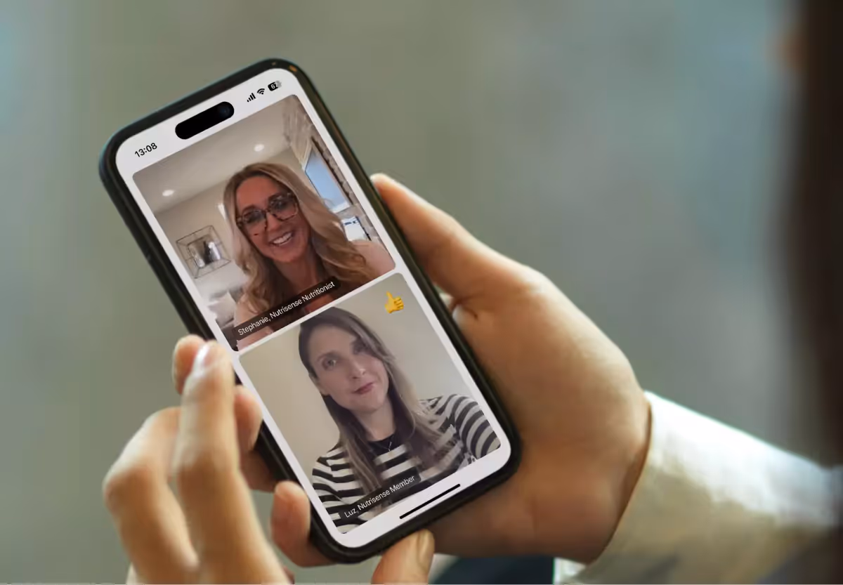 A closeup of a phone screen with a video call with a nutrisense nutritionist and member 