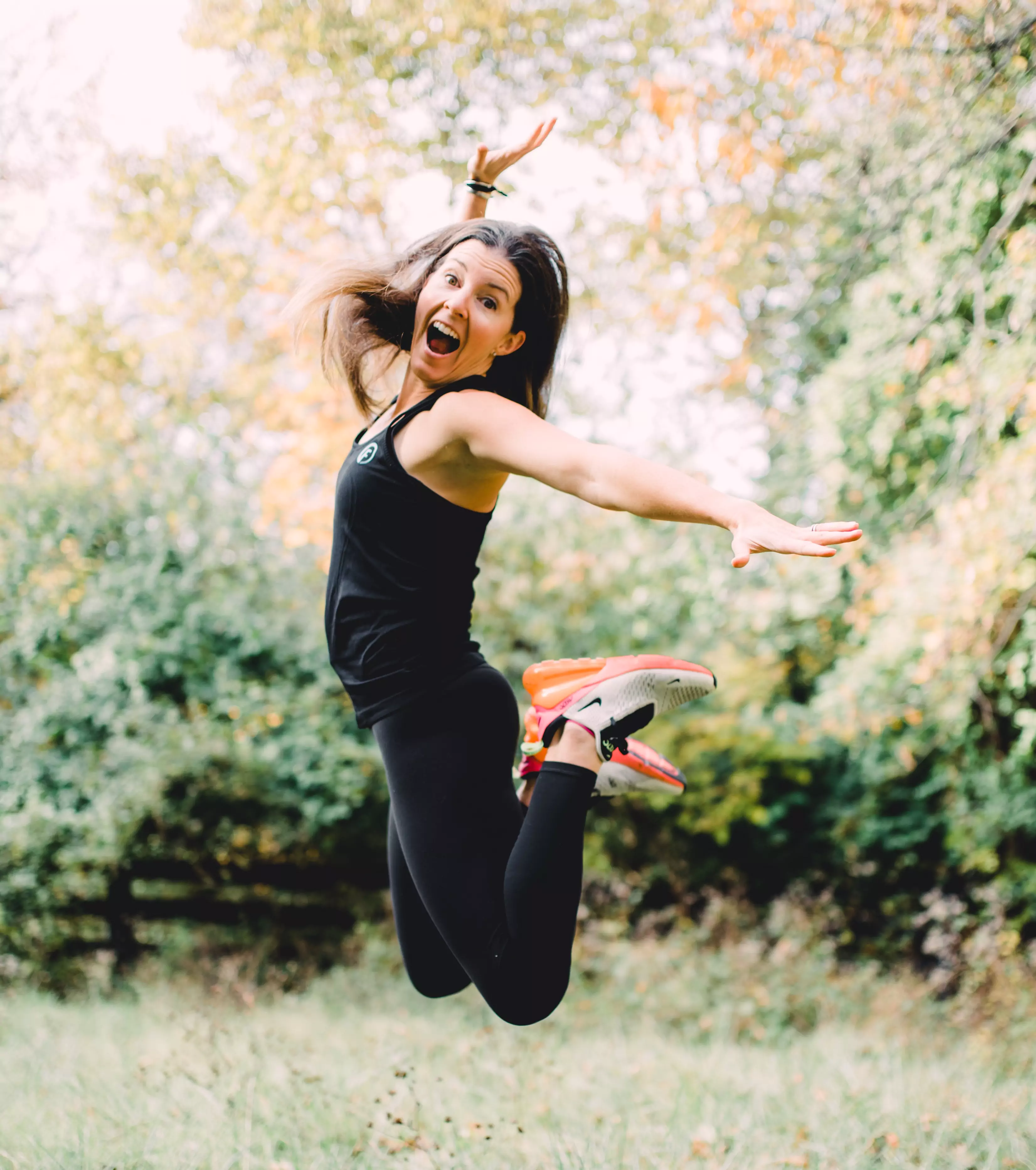Leigh Reckner mid-jump outdoors