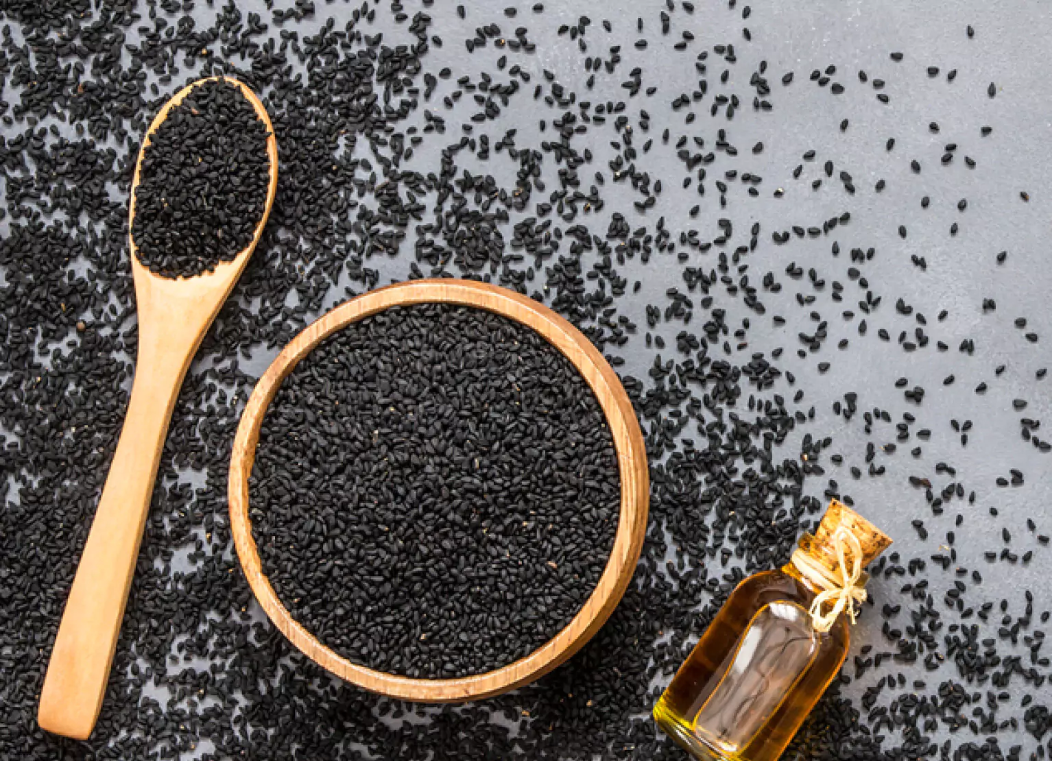 a bowl and spoonful of nigella sativa
