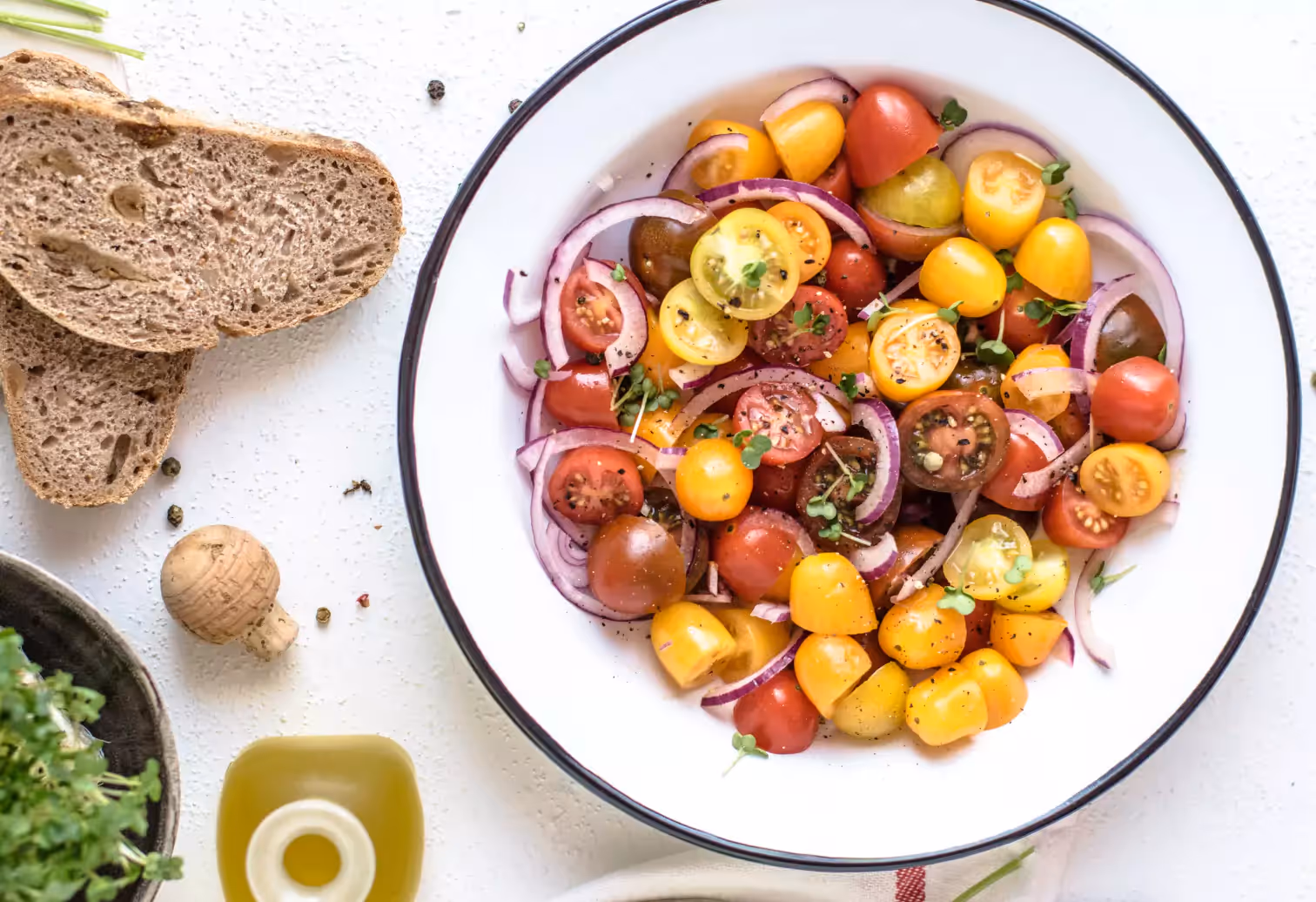 a plate of tomateos with onion