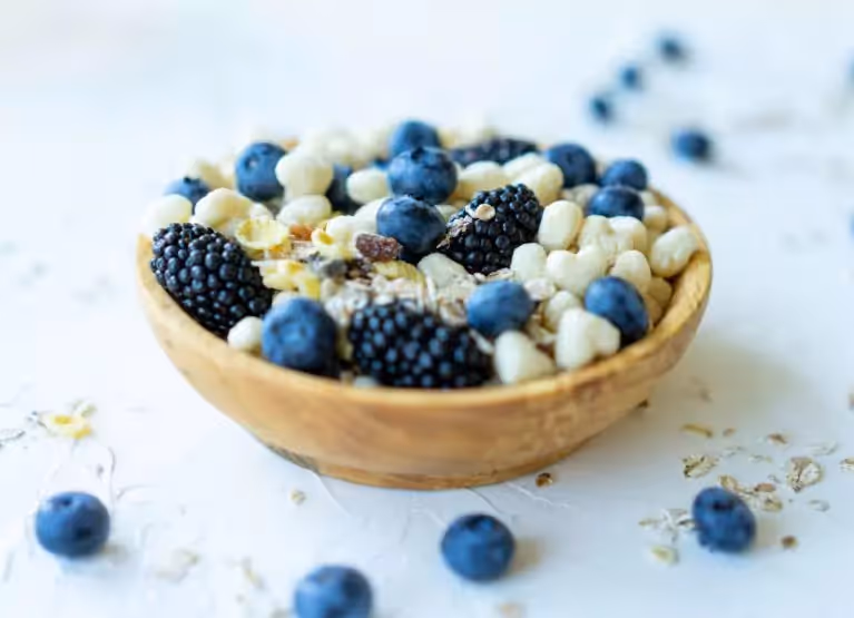 a bowl with berries and cereal