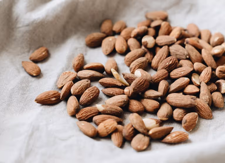 A cloth with a heap of almonds laid on it