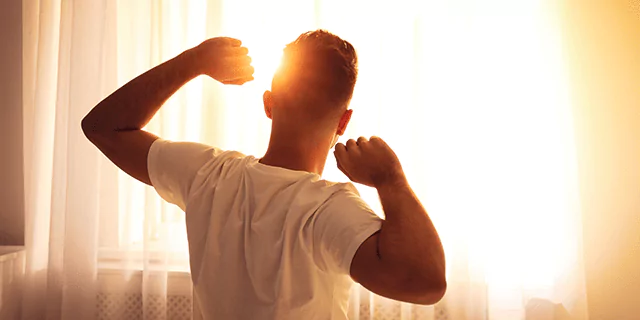 a person waking up in the morning