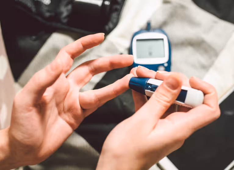 someone checking their blood sugar