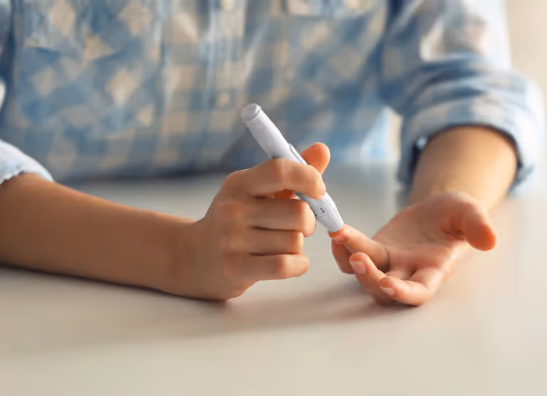 someone pricking their finger