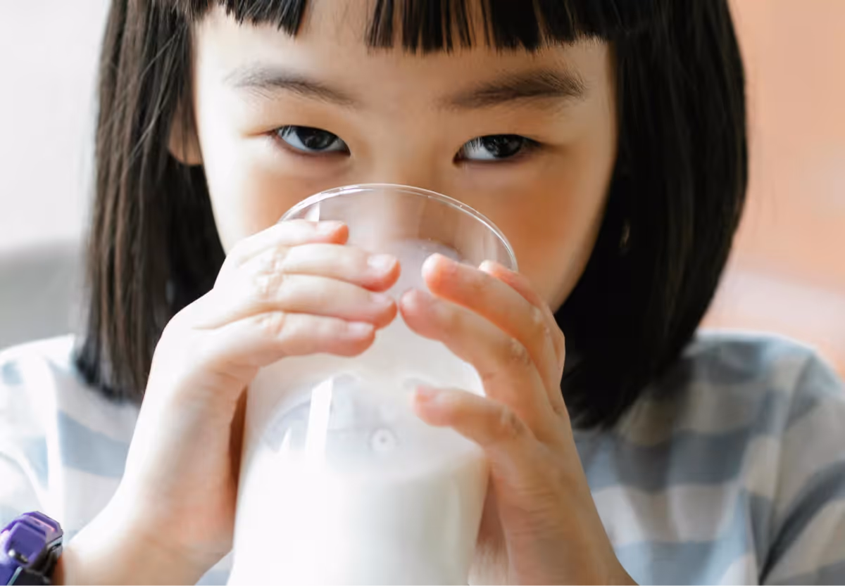 a girl drinking raw milk