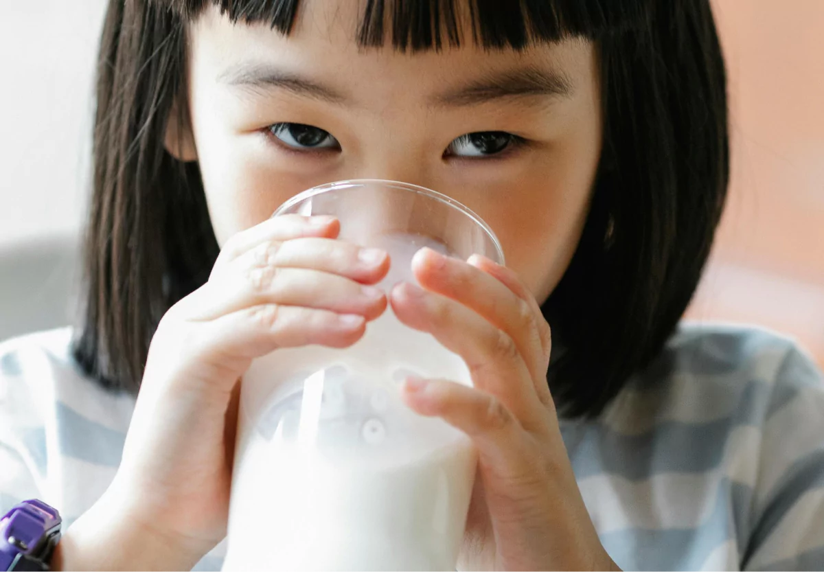 a girl drinking raw milk