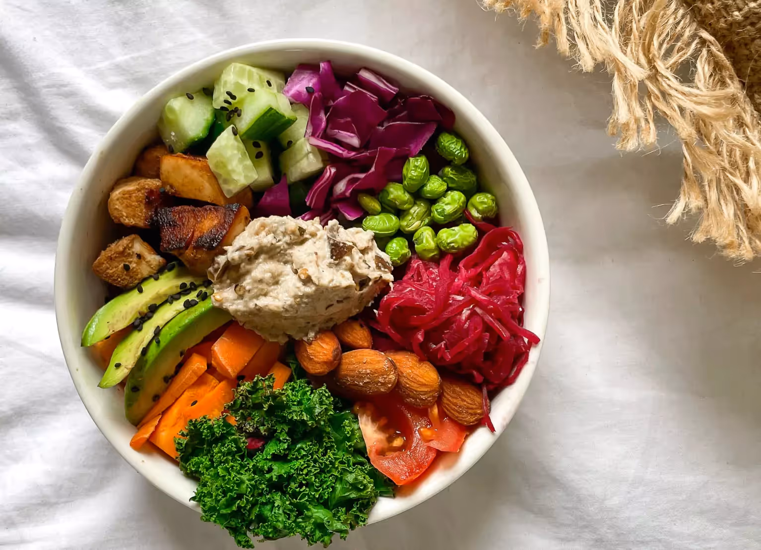 a garden bowl with potatoes and greens