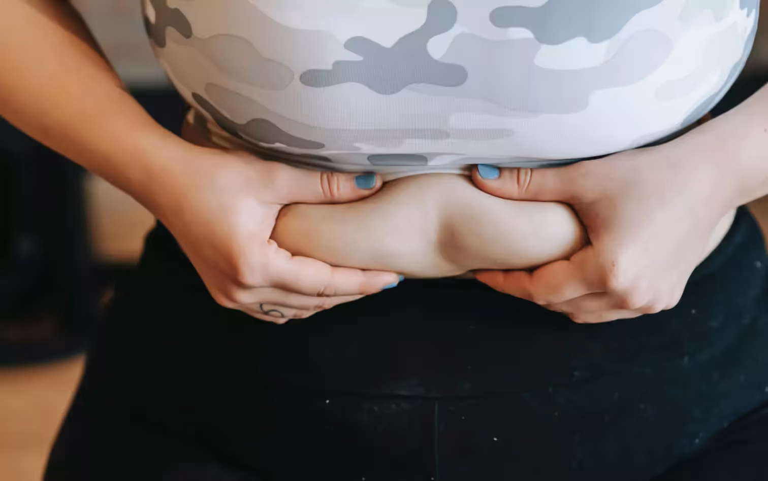 a person squeezing their stomach