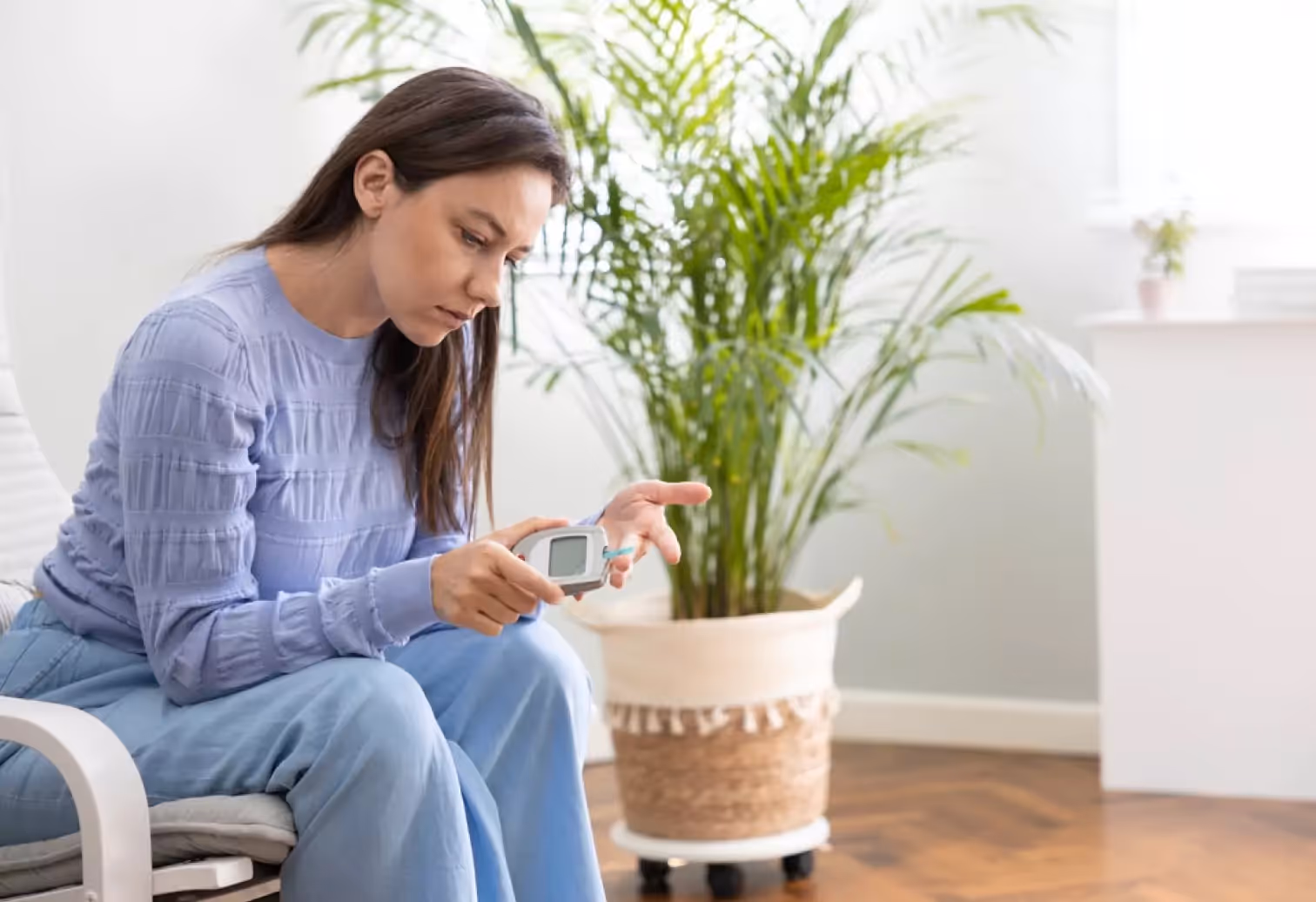 a person measuring their blood sugar
