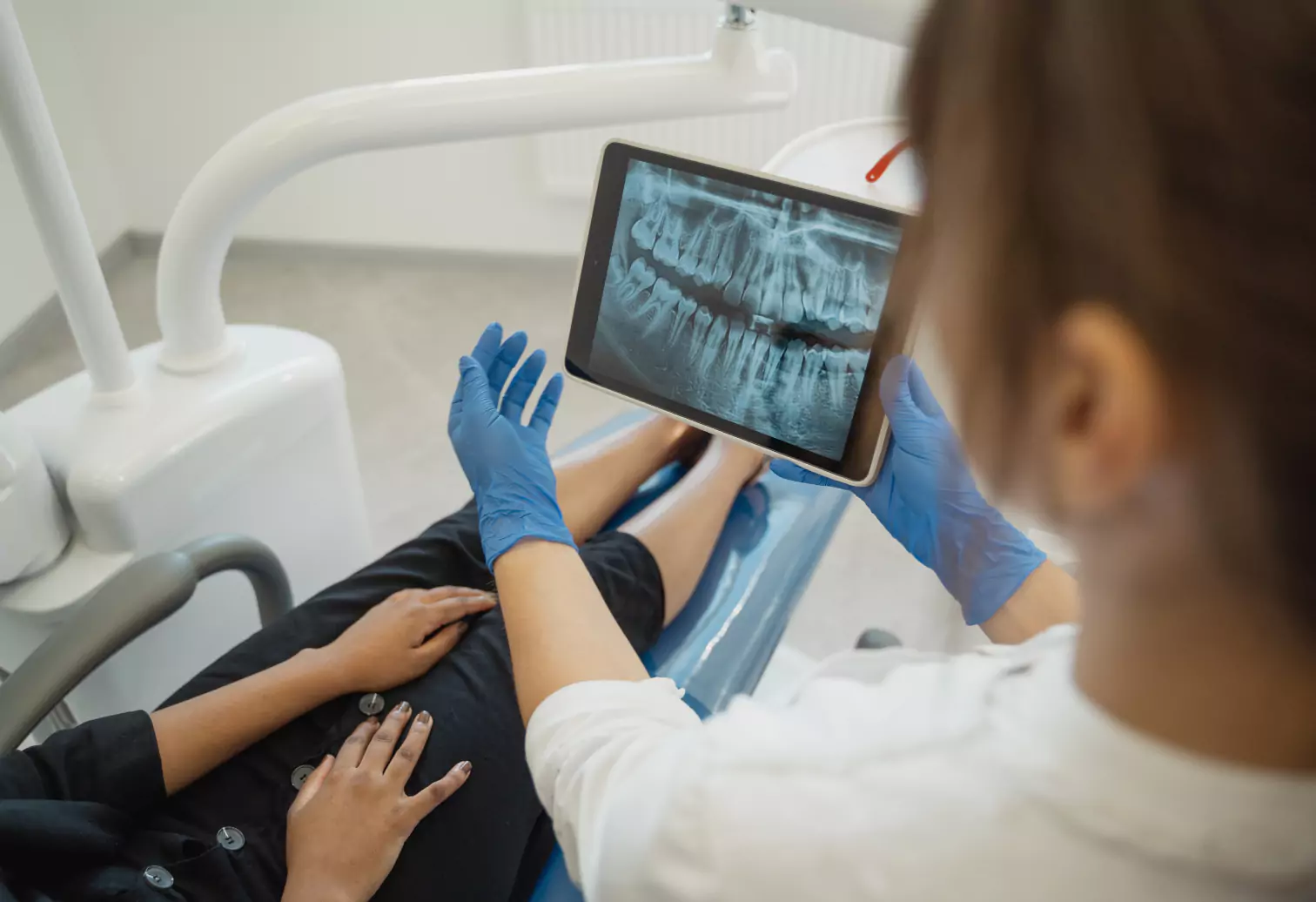 a dentist showing x rays