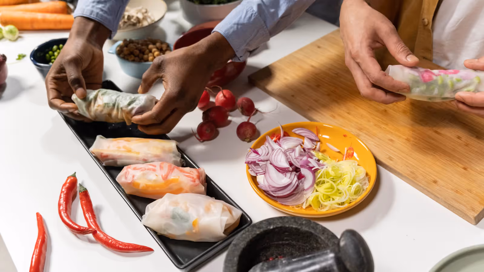 two people cooking in the kitchen 