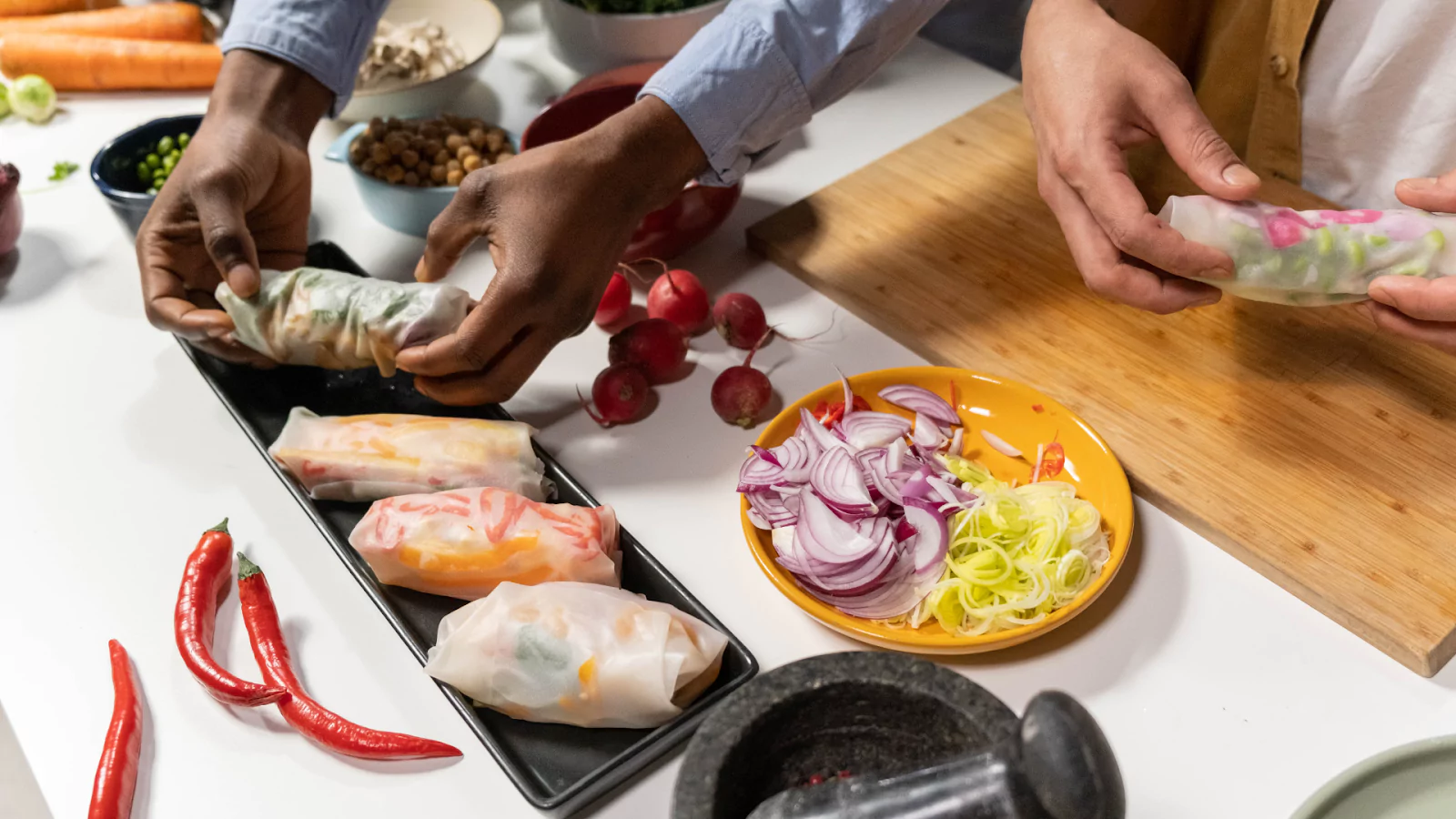 two people cooking in the kitchen
