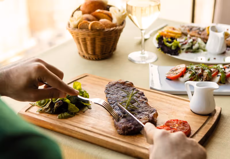 a plate of steak and cheese