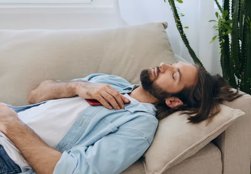 a man laying down for a nap