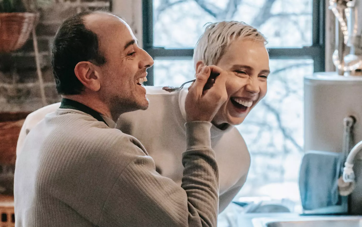 A couple eating and laughing