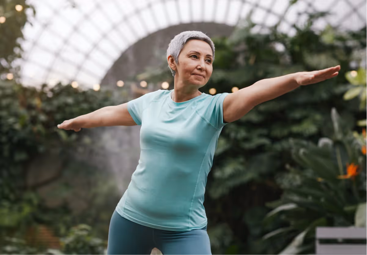 a woman doing yoga outside
