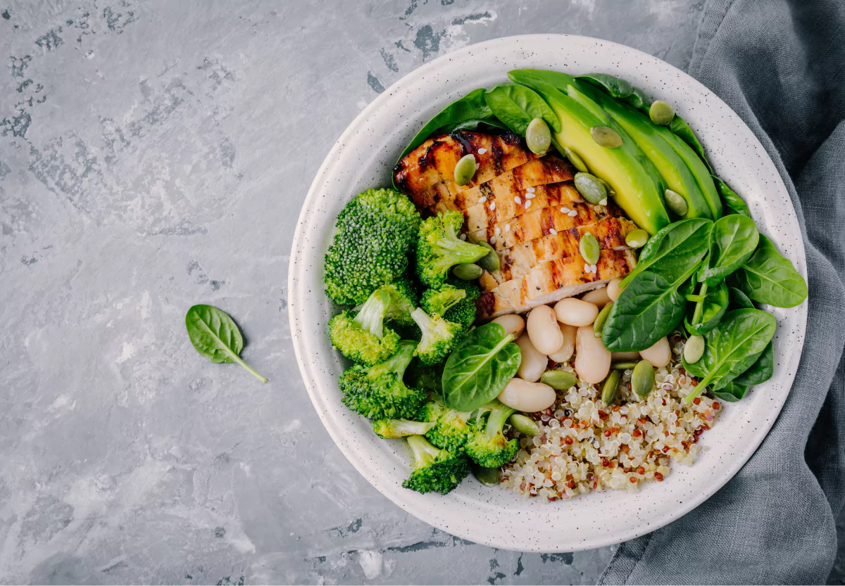 a nourish bowl with chicken, veggies, and rice