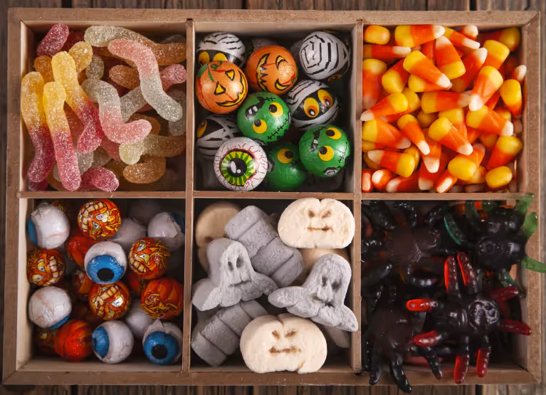 a wooden box with assorted candy